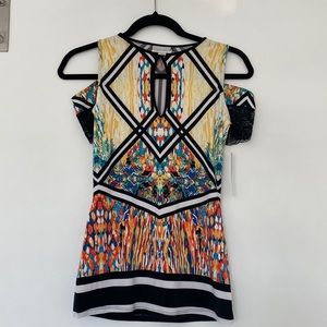 Brand new XS colorful cold shoulder with center cut out.